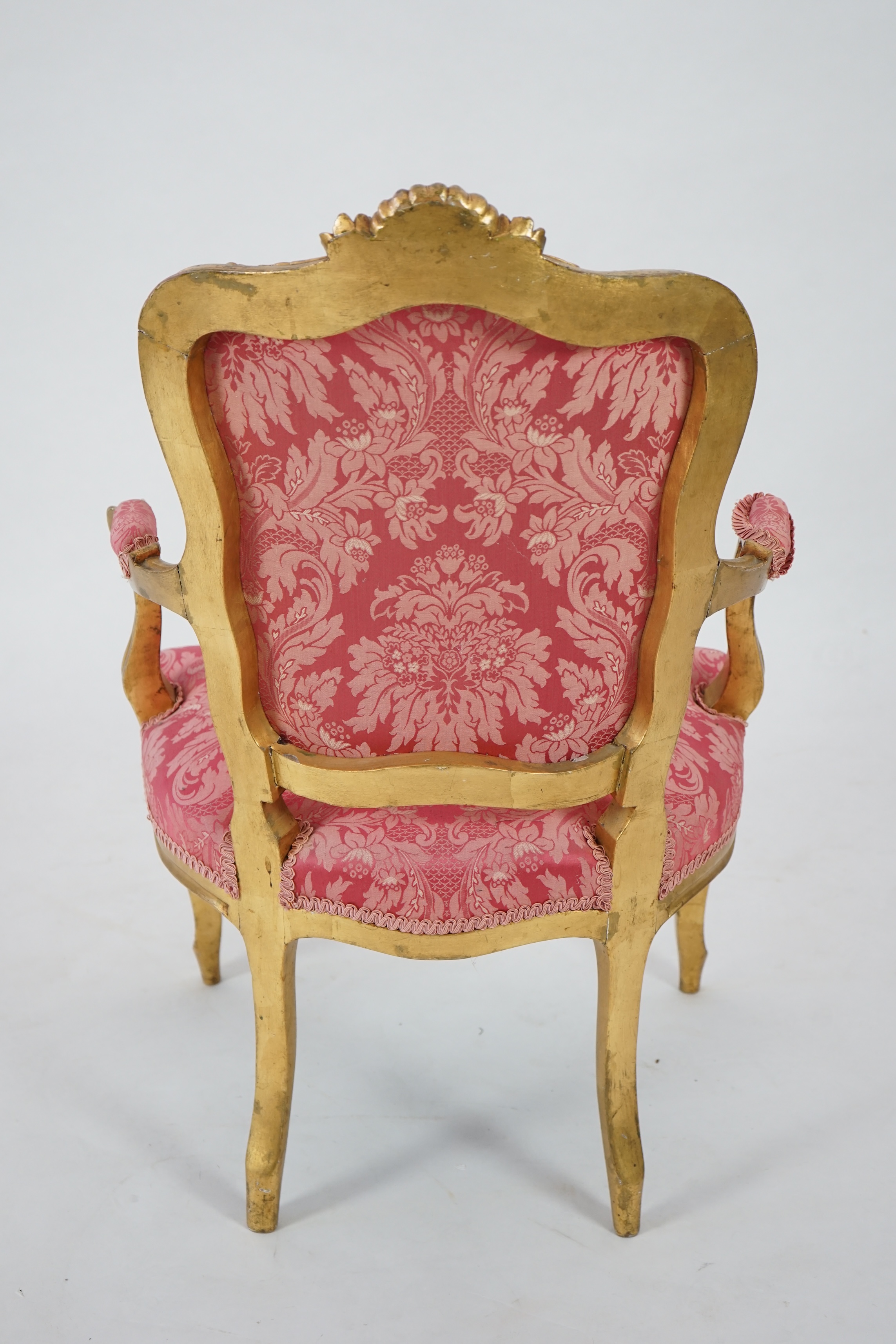 A Louis XV style carved giltwood fauteuil